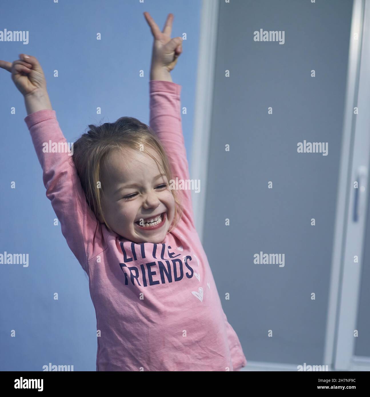 Happy and smiling cute young girl Hold Hands Up Stock Photo - Alamy