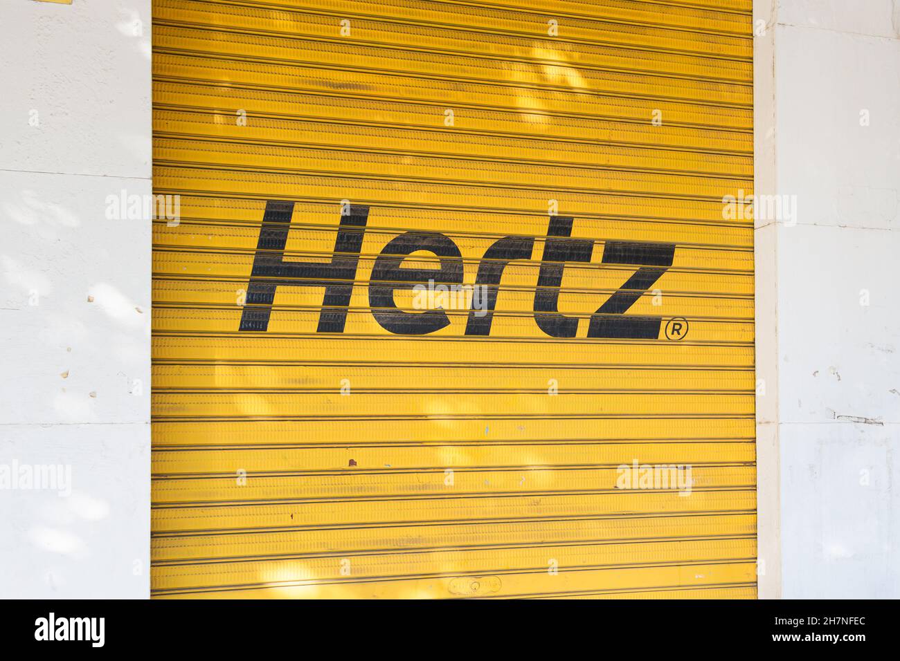 VALENCIA, SPAIN - NOVEMBER 23, 2021: Hertz is an American car rental company based in Florida Stock Photo