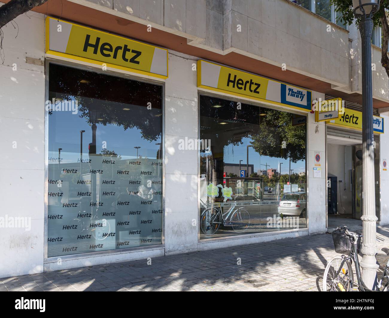 VALENCIA, SPAIN - NOVEMBER 23, 2021: Hertz is an American car rental company based in Florida Stock Photo