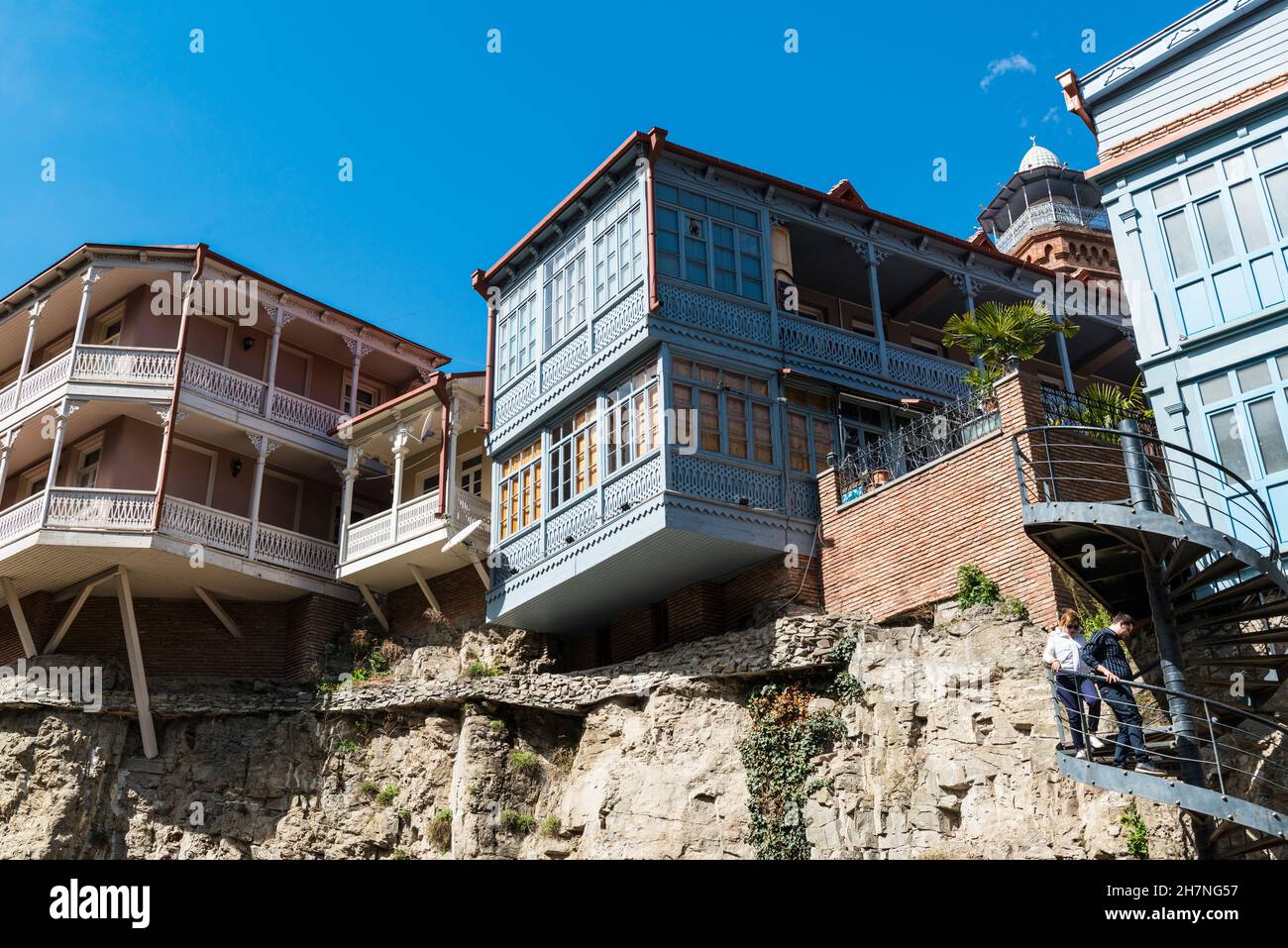 Historic wooden houses with open, carved balconies in the Abanotubani area  of the Old Town of Tblisi, Georgia, Caucasus. Stock Photo