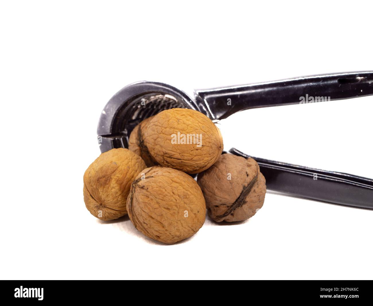 Nutcracker with walnuts isolated on a white background Stock Photo