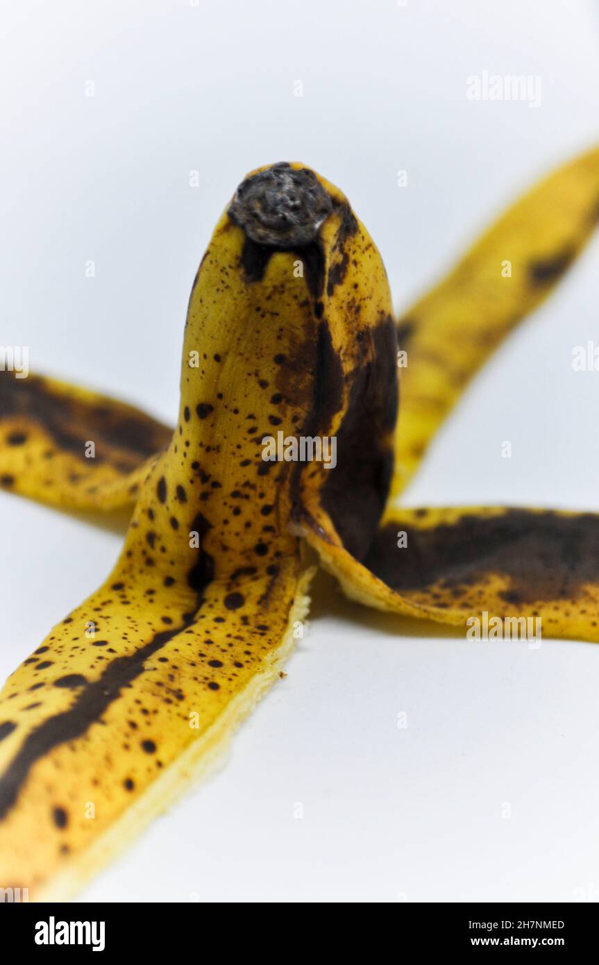 Skin of a ripe banana set against a white background Stock Photo