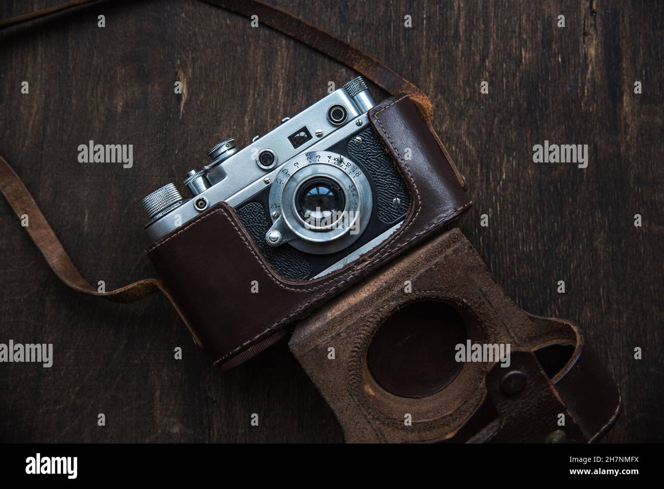 Retro photo camera with a leather case. Stock Photo