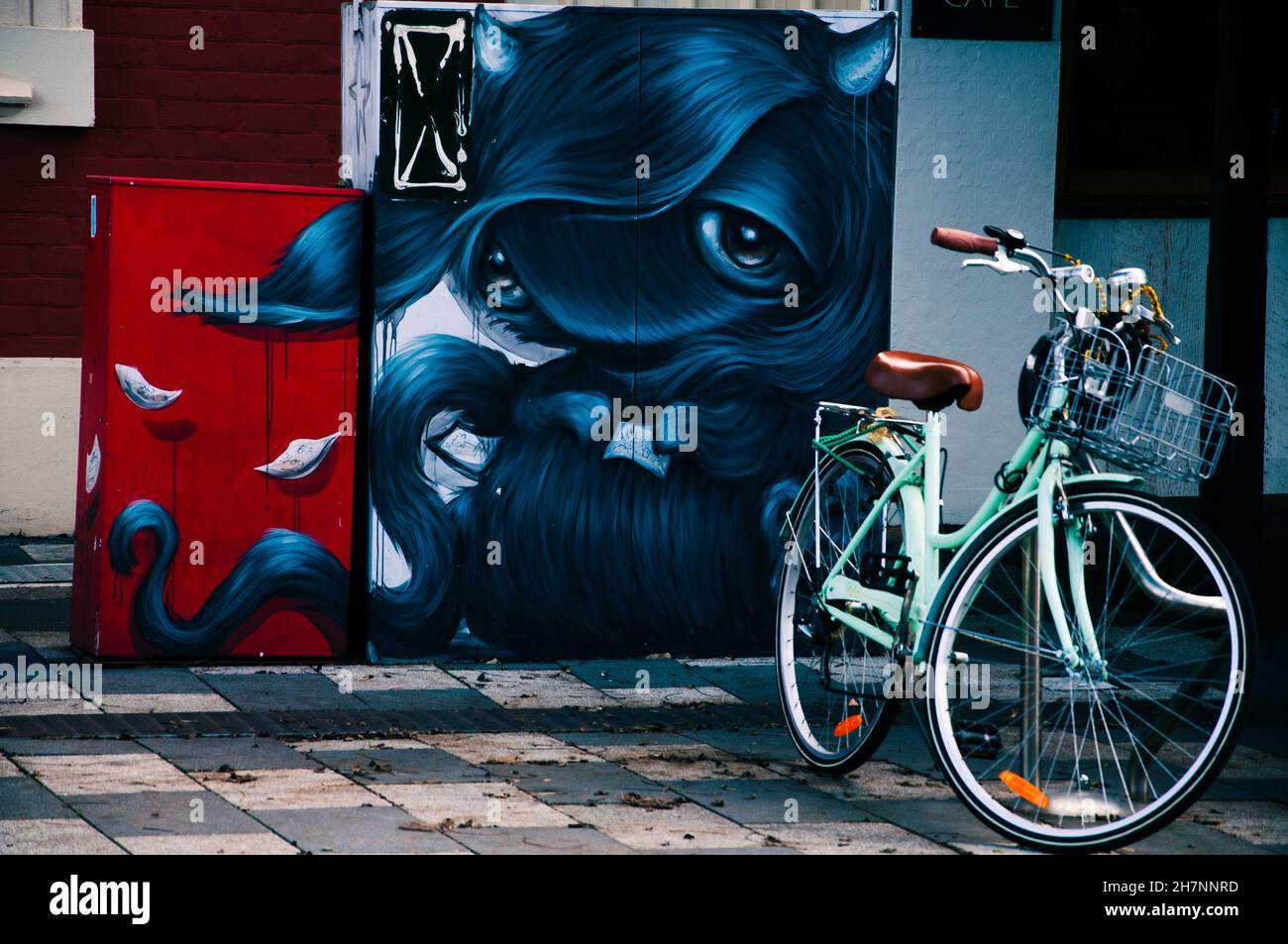Old School bike next to a urban graffiti in Regional town Australia Stock Photo
