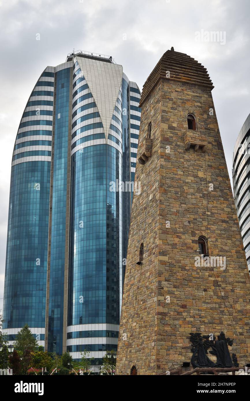Grozny, Russia - Sept 13, 2021: View on  the skyscrapes and restored medieval battle tower in capital city of the Chechen Republic in the Russian Fede Stock Photo