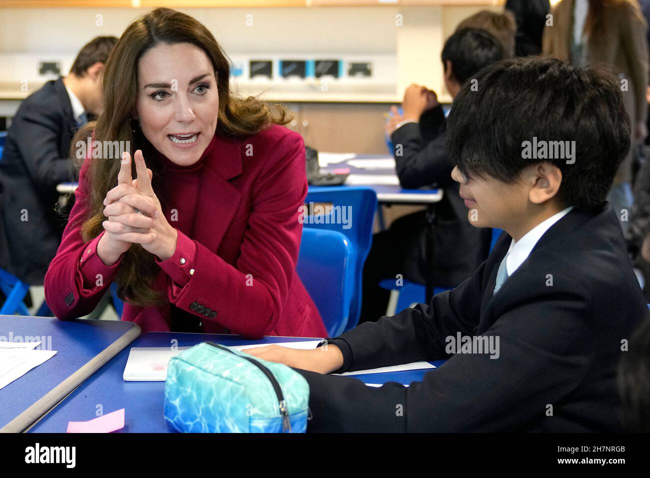 The Duchess of Cambridge speaks to students during a visit to Nower Hill High School in Harrow, north London, to join a science lesson studying neuroscience and the importance of early childhood development. Picture date: Wednesday November 24, 2021. Stock Photo