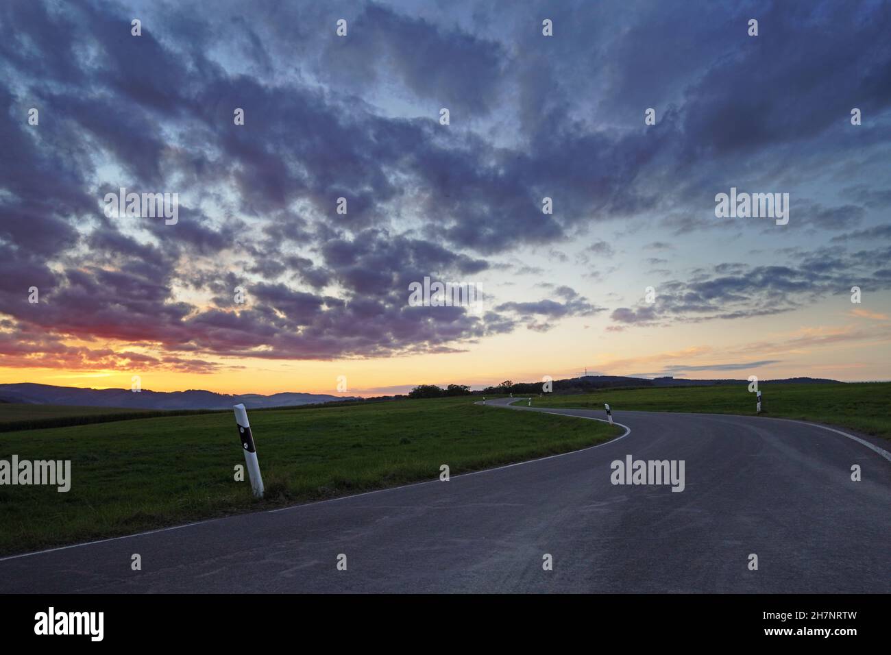Sunset in the Sauerland. Landscape with setting sun in the evening. Stock Photo