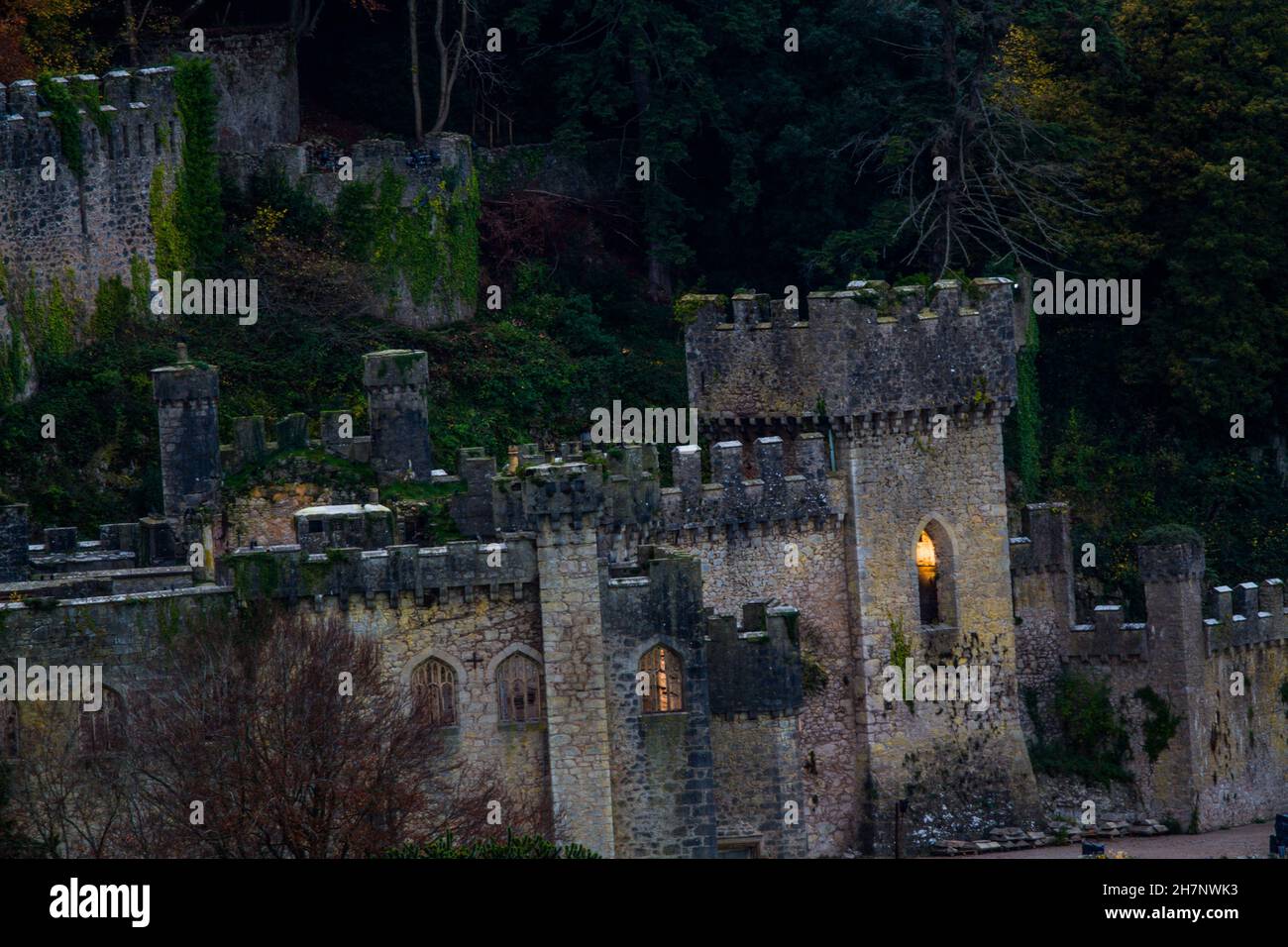 Telephoto evening view of Gwrych Castle one week before I’m a Celebrity Get me Out Of Here 2021. Surrounded by autumnal trees, landscape Stock Photo