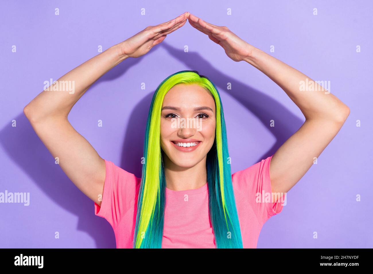 Photo of positive lady arms up yellow green blue haircut new buying apartment concept isolated over violet color background Stock Photo