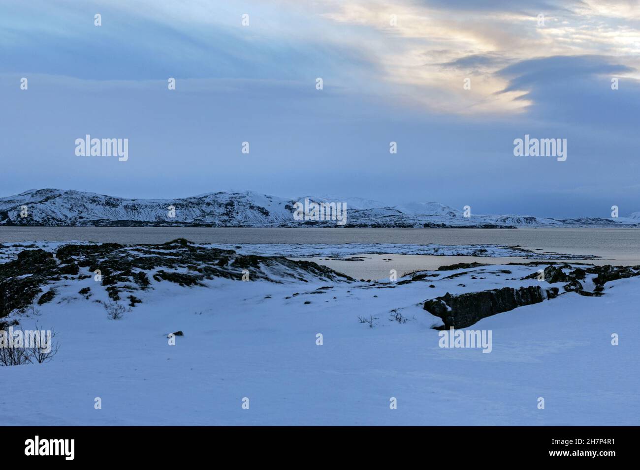 Real charming snow-covered landscapes of Iceland at cloudy dusk winter time Stock Photo