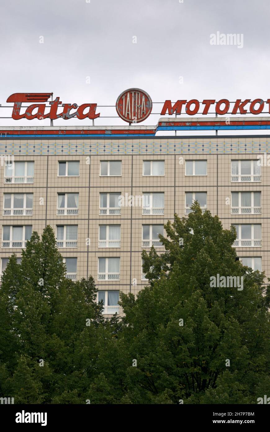 old advertising with LKW Tatra Motokov sign from DDR era on the roof of building in Karl Marx Allee, Friedrichshain, Berlin German Stock Photo