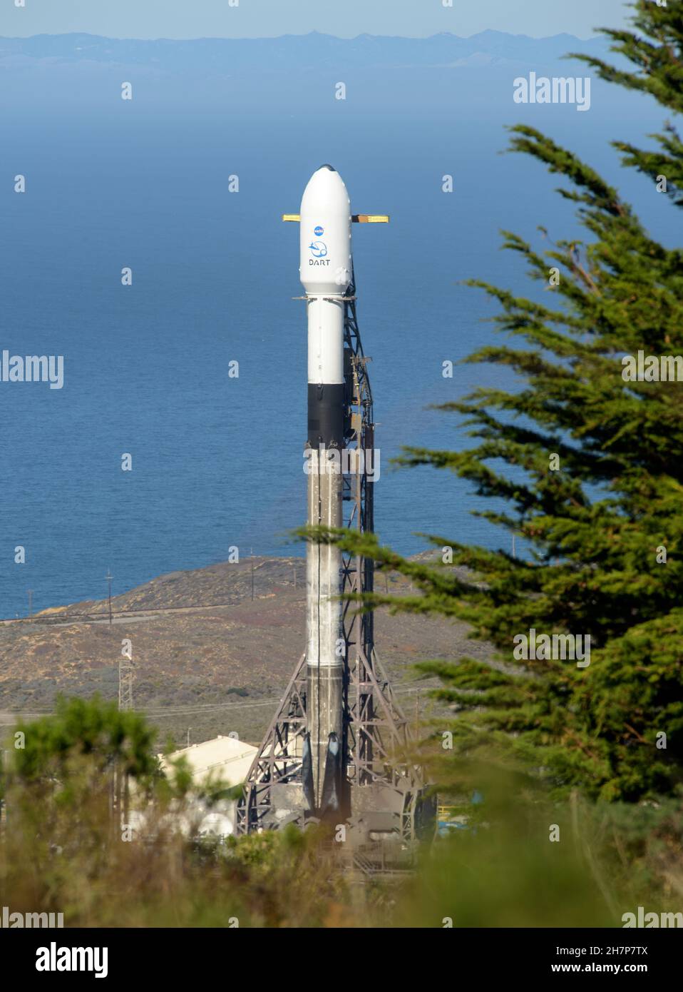 Vandenberg, United States Of America. 23rd Nov, 2021. Vandenberg, United States of America. 23 November, 2021. A SpaceX Falcon 9 booster rocket carrying the NASA planetary defense test mission, Double Asteroid Redirection Test, prepares for lift off from Space Launch Complex-4 at Vandenberg Space Force Base November 23, 2021 in Vandenberg, California. The DART spacecraft is designed to crash into an asteroid while traveling at a speed of 15,000 miles per hour to alter the path to prevent impact on Earth. Credit: Bill Ingalls/NASA/Alamy Live News Stock Photo
