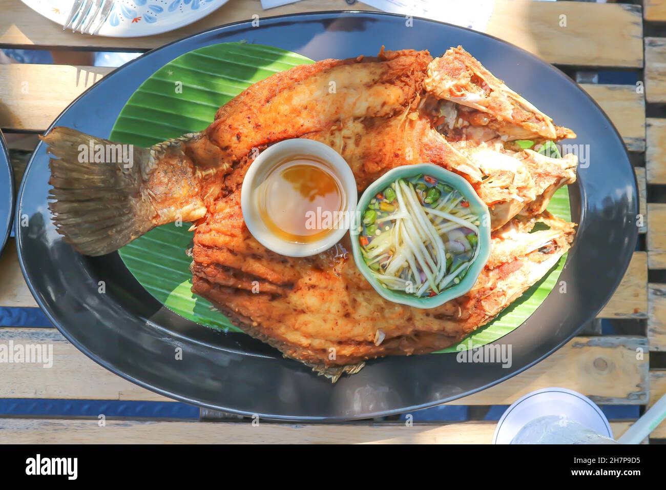 deep fried fish, deep fried bass or deep fried striped bass with dip Stock Photo Alamy