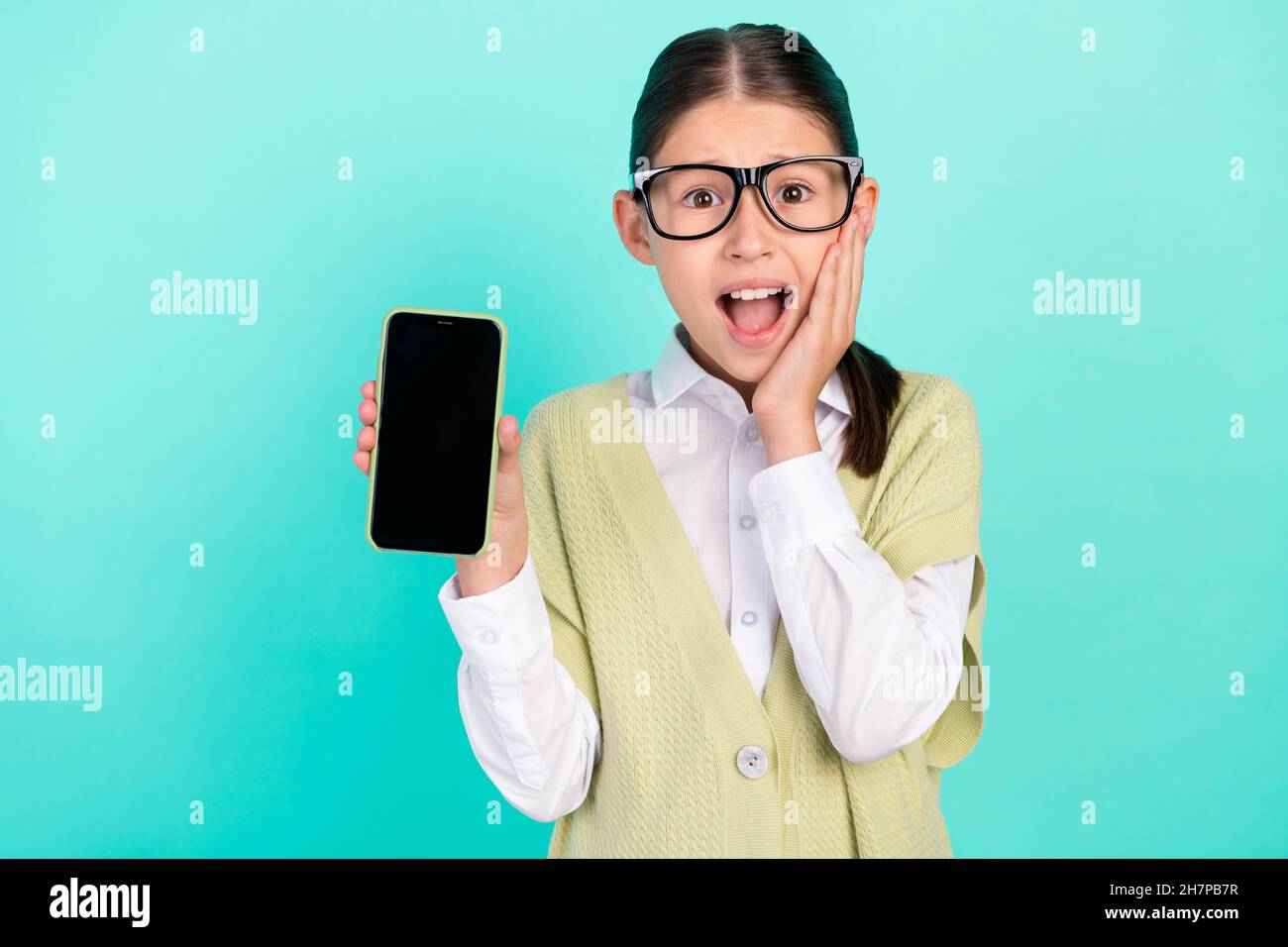Photo of crazy excited lady hold telephone show touch screen wear green