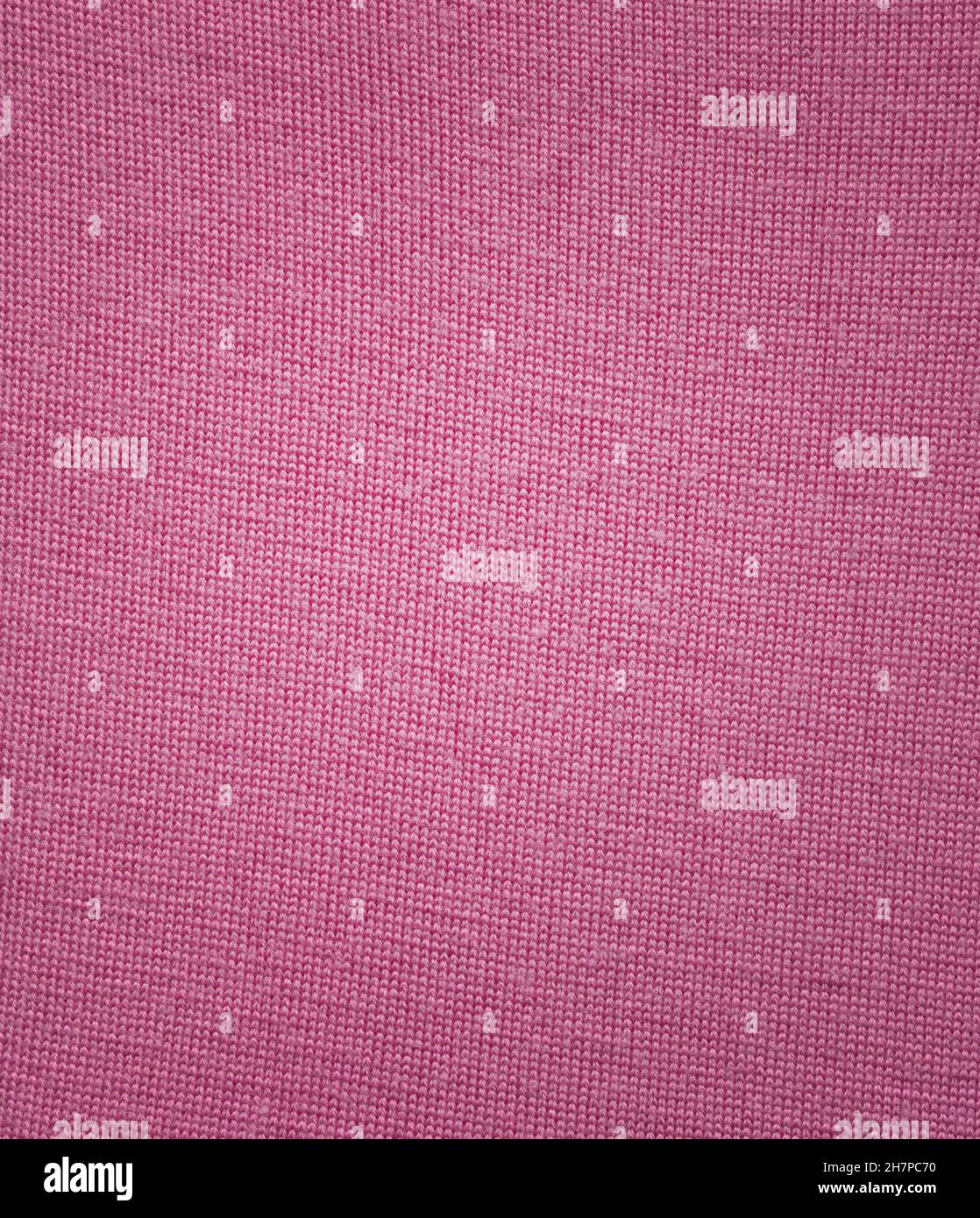 Winter pink simple fabric wool scarf pattern. Pink wool sweater texture. Stock Photo