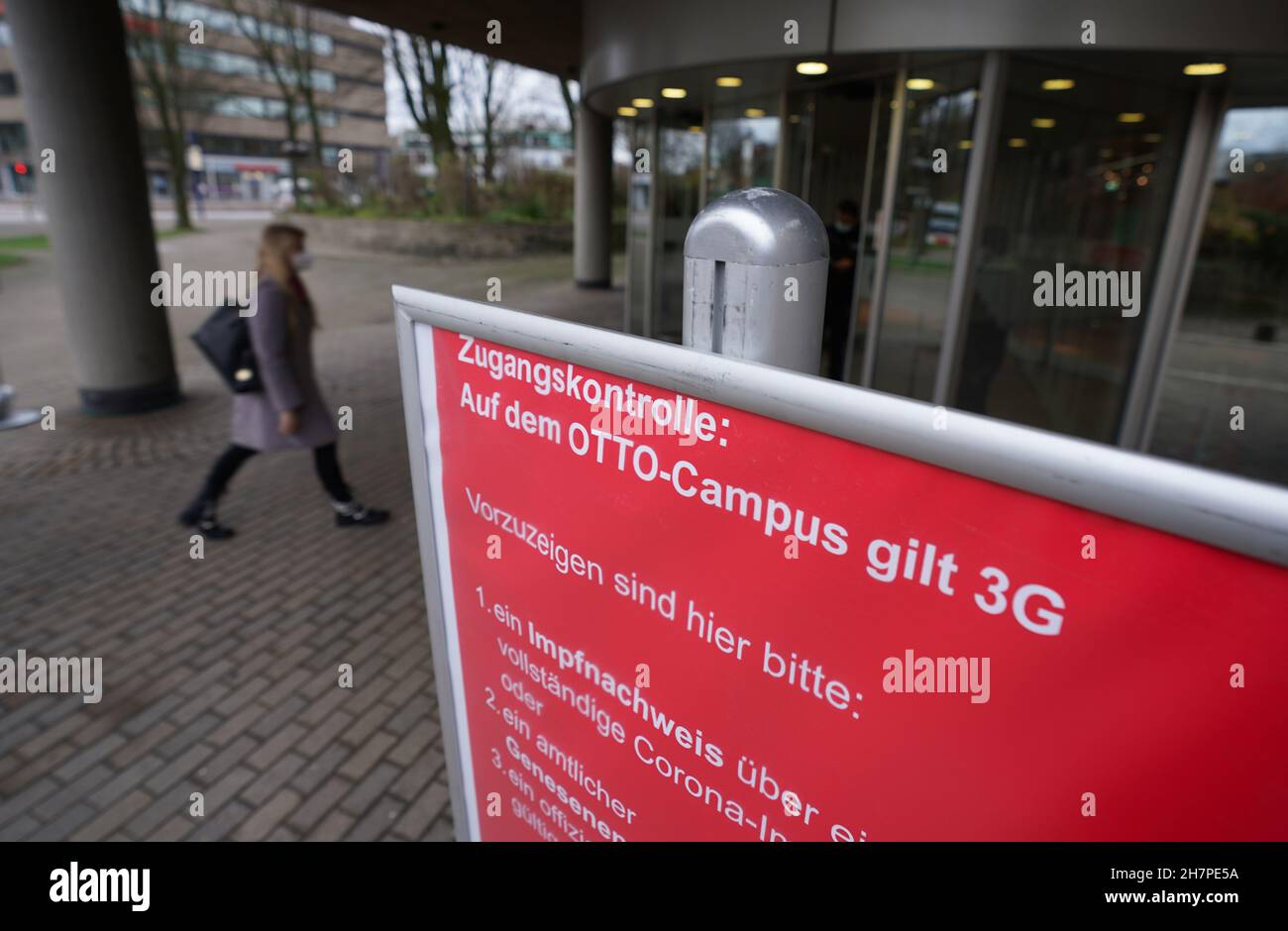 Hamburg, Germany. 24th Nov, 2021. A sign about 3G access controls stands in front of the entrance to the Otto Group campus. The new Infection Protection Act with rules for 3G in the workplace has come into force. Employees are then only to be granted access to companies if they have been vaccinated, recovered or tested. Credit: Marcus Brandt/dpa/Alamy Live News Stock Photo