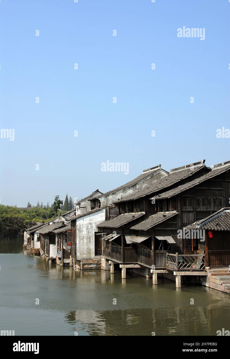 Wuzhen Water Town, Zhejiang Province, China. Traditional wooden houses beside a canal in the old Chinese town of Wuzhen. Wuzhen Canal Town is also kno Stock Photo