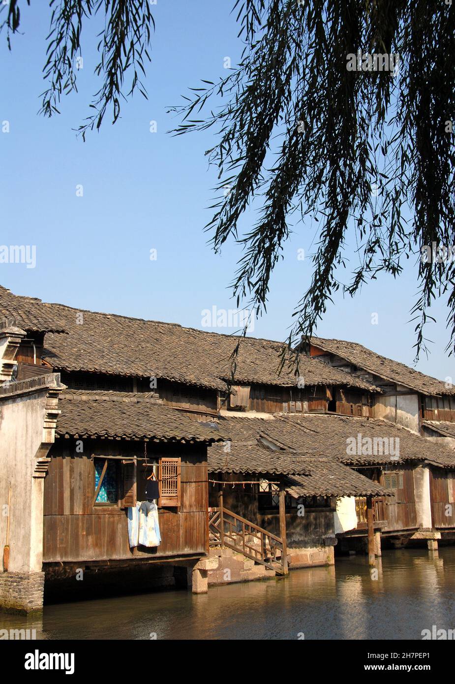 Wuzhen Water Town, Zhejiang Province, China. Traditional wooden houses beside a canal in the old Chinese town of Wuzhen. Stock Photo