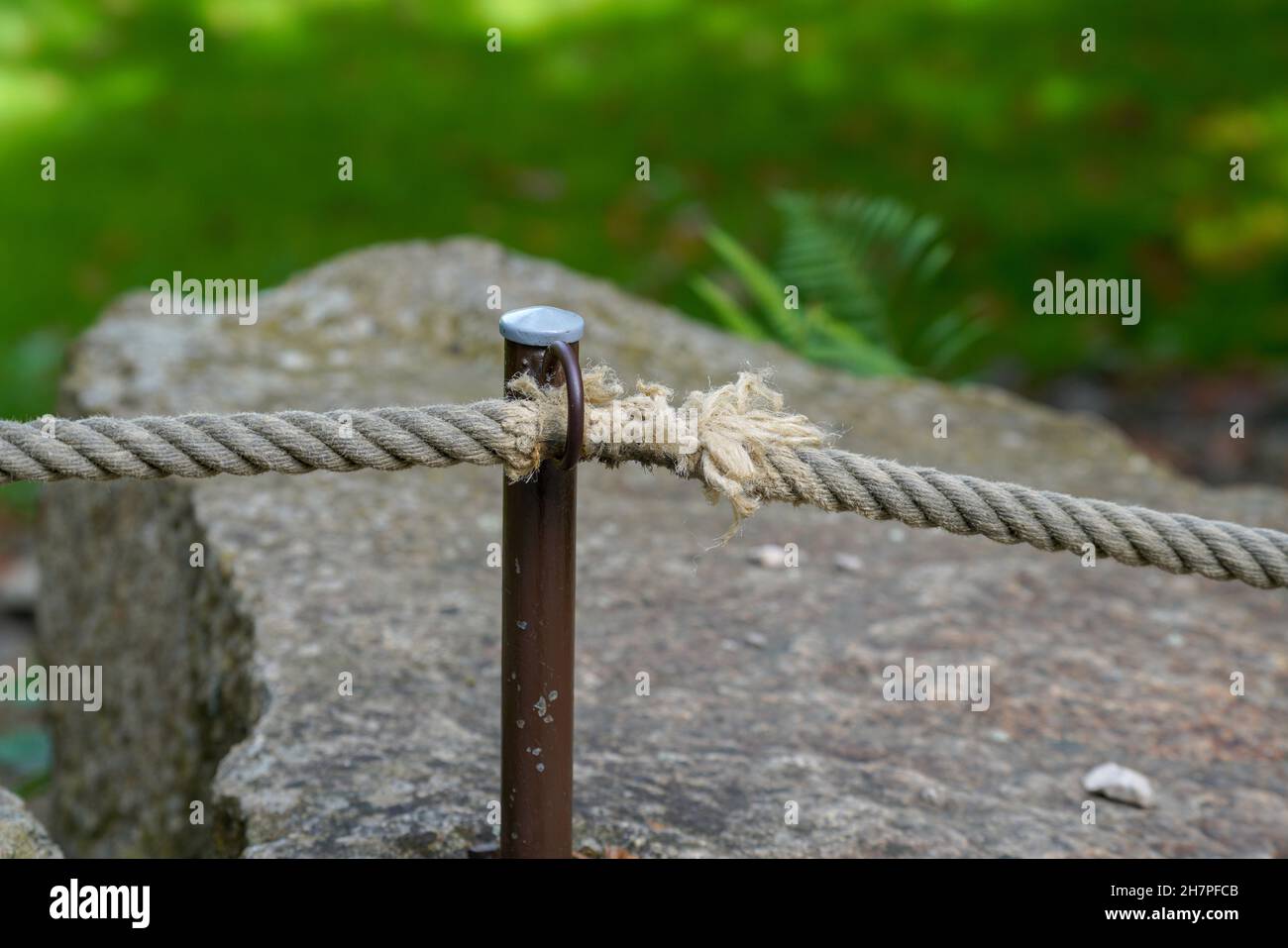 Rope fence with a metal pin bracket Stock Photo Alamy