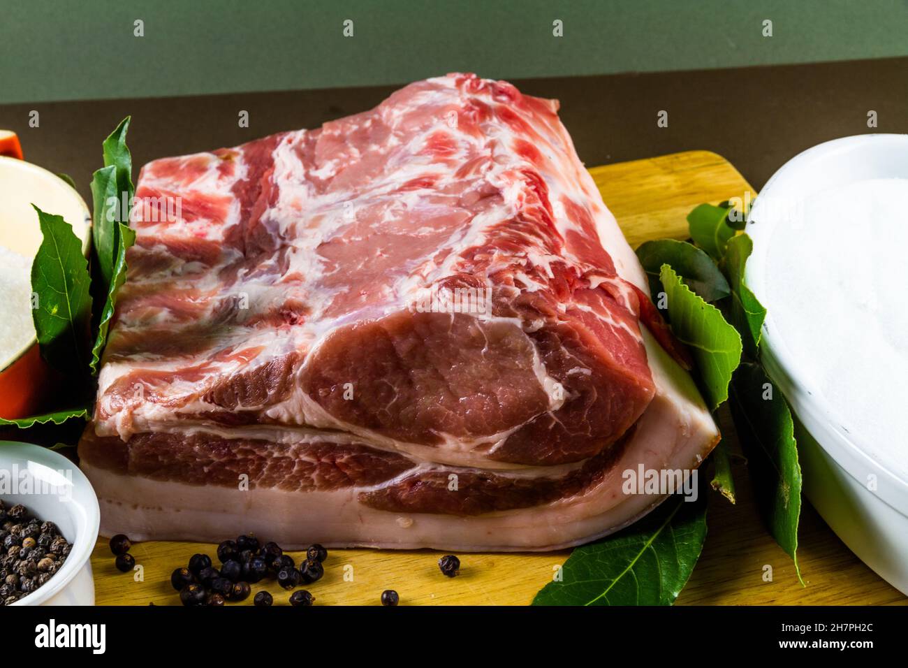 Pork loin or back joint with ingredients for dry curing into bacon