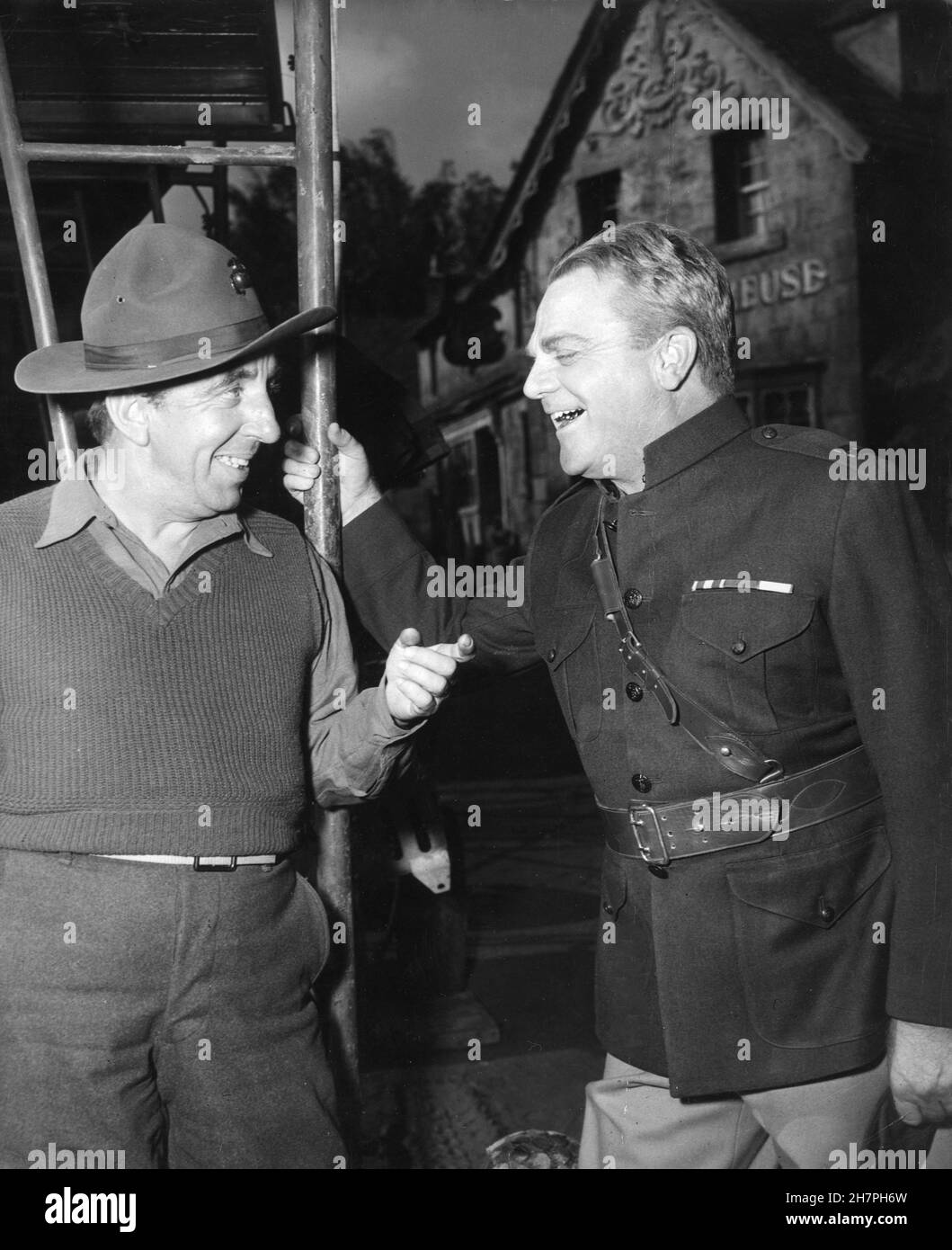 WALLY VERNON and JAMES CAGNEY (in costume as Captain Flagg) on set candid during filming of WHAT PRICE GLORY 1952 director JOHN FORD play Maxwell Anderson and Laurence Stallings Twentieth Century Fox Stock Photo
