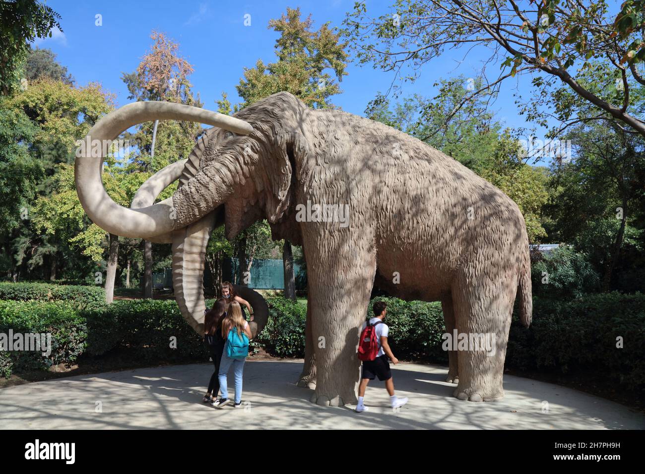 BARCELONA, SPAIN - OCTOBER 7, 2021: People visit the mammoth statue in Parc de la Ciutadella in Barcelona, Spain. Stock Photo