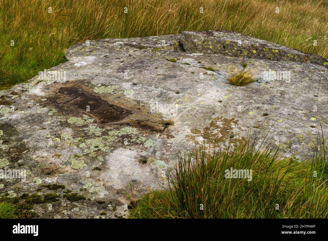 North Wales Rock Cannon, holes in rock or boulder. Gun powder used to make bangs in celebrations landscape. Stock Photo