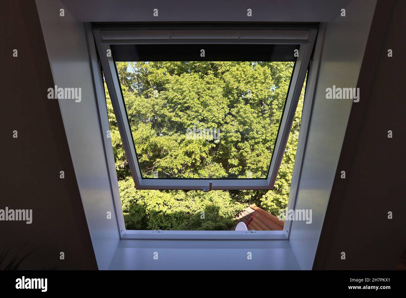 Sloped ceiling roof window in Europe. Generic house attic window Stock ...