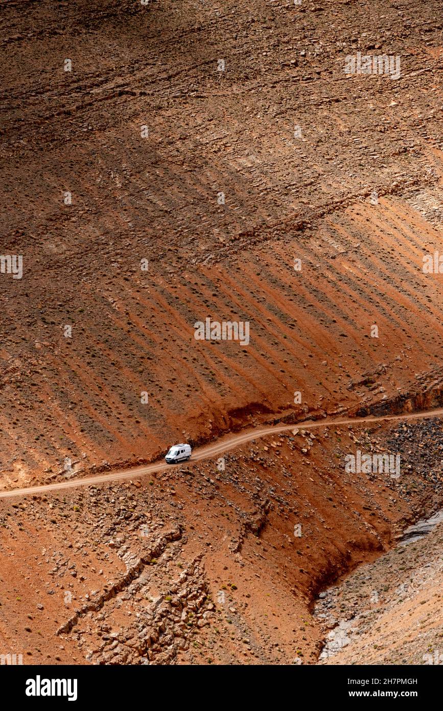 Images of Morocco. A 4x4 van on the dirt road down to the Dades Valley in the Atlas Mountains Stock Photo