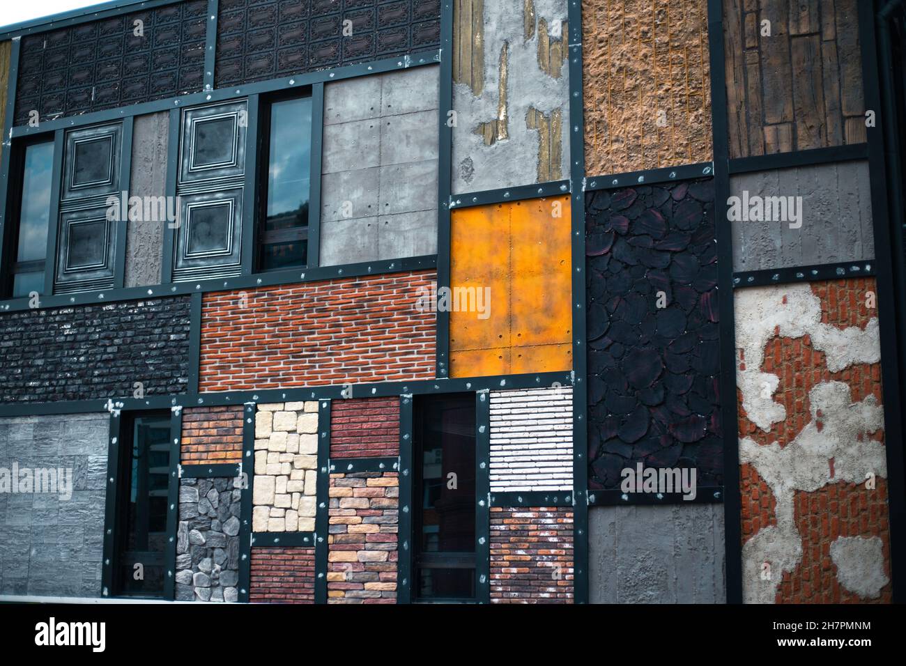 Types of facade finishing materials demonstrated outdoors by the store