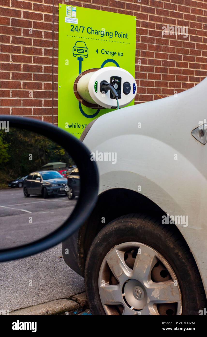 Electric vehicle charging point for cars outside a supermarket in