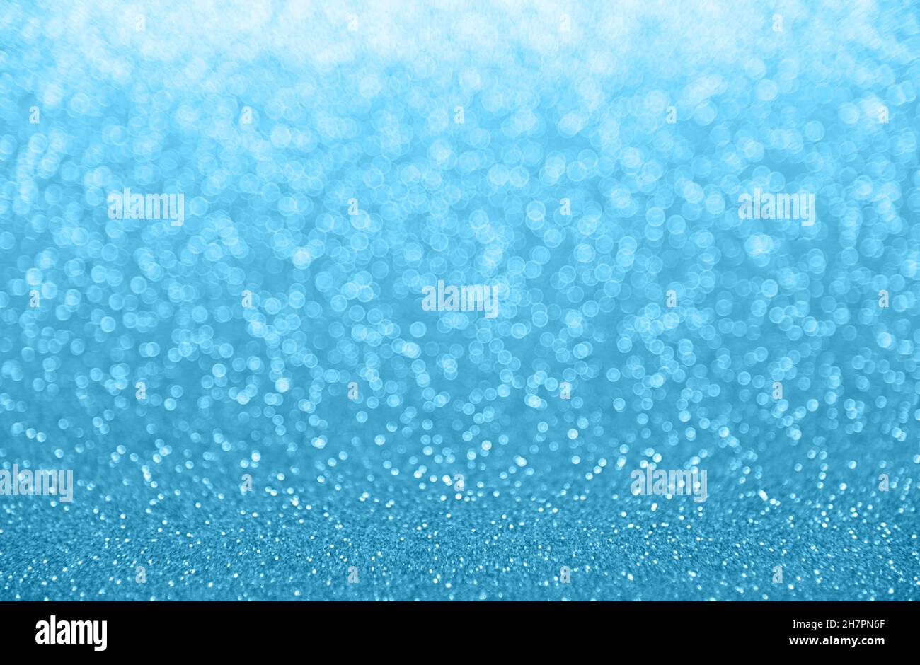 Abstract background of cold winter blue bokeh defocused blurred lights ...