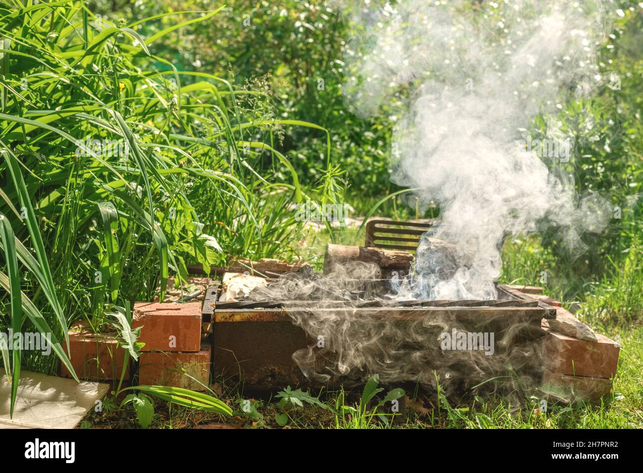 barbecue grill with smoke. backyard outdoors Stock Photo - Alamy