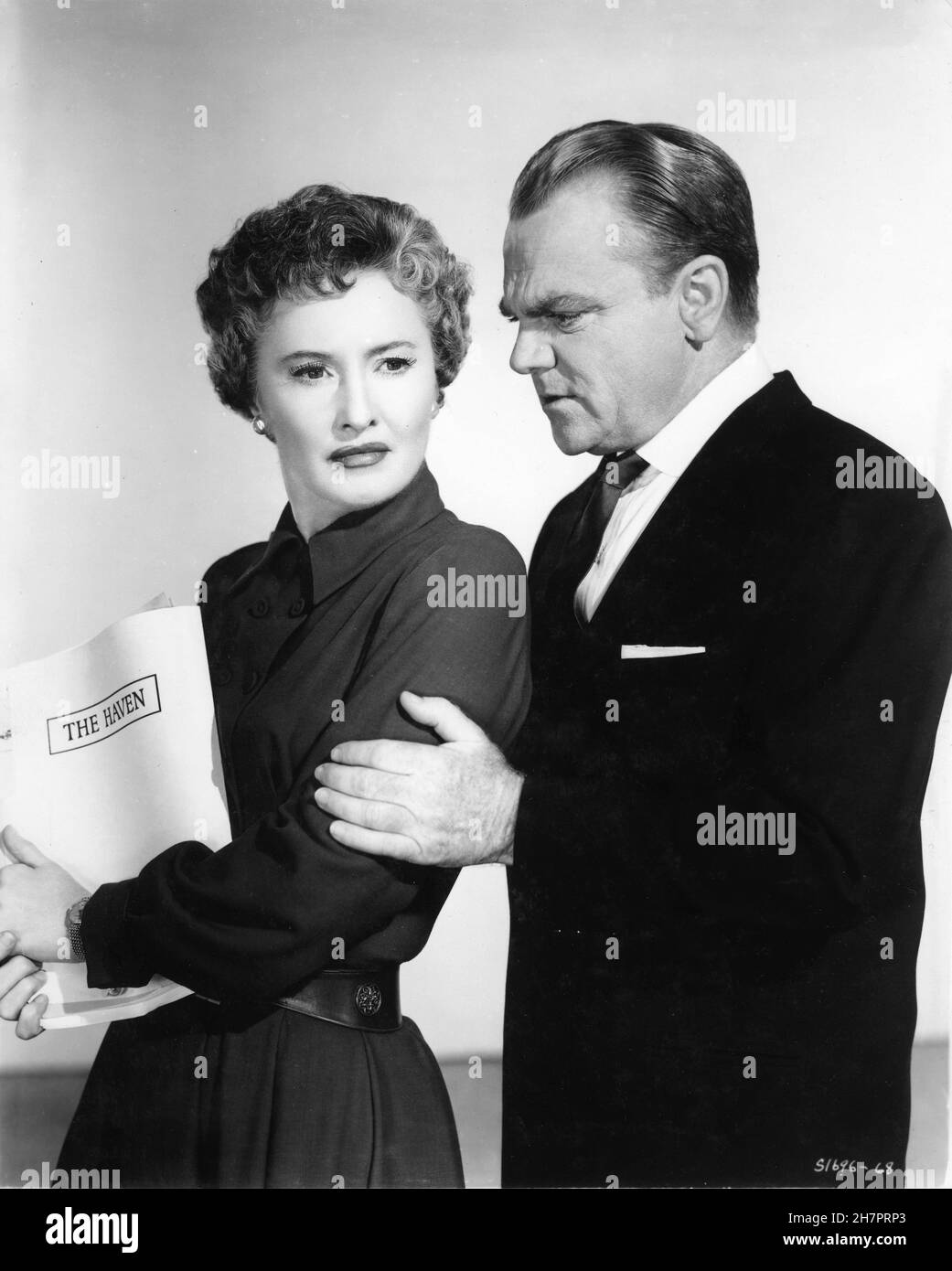 BARBARA STANWYCK and JAMES CAGNEY Publicity Portrait in THESE WILDER YEARS 1956 director ROY ROWLAND costumes for Miss Stanwyck Helen Rose Metro Goldwyn Mayer Stock Photo