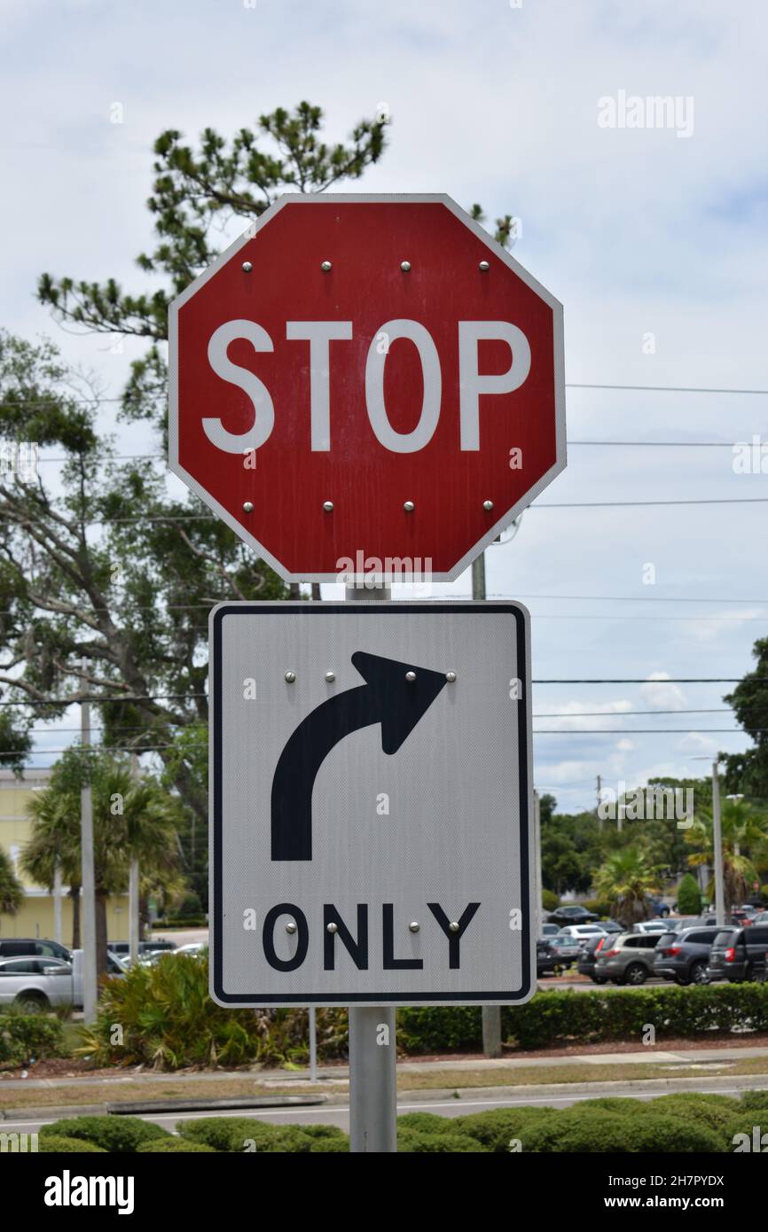 A stop sign and right turn only arrow sign. Stock Photo