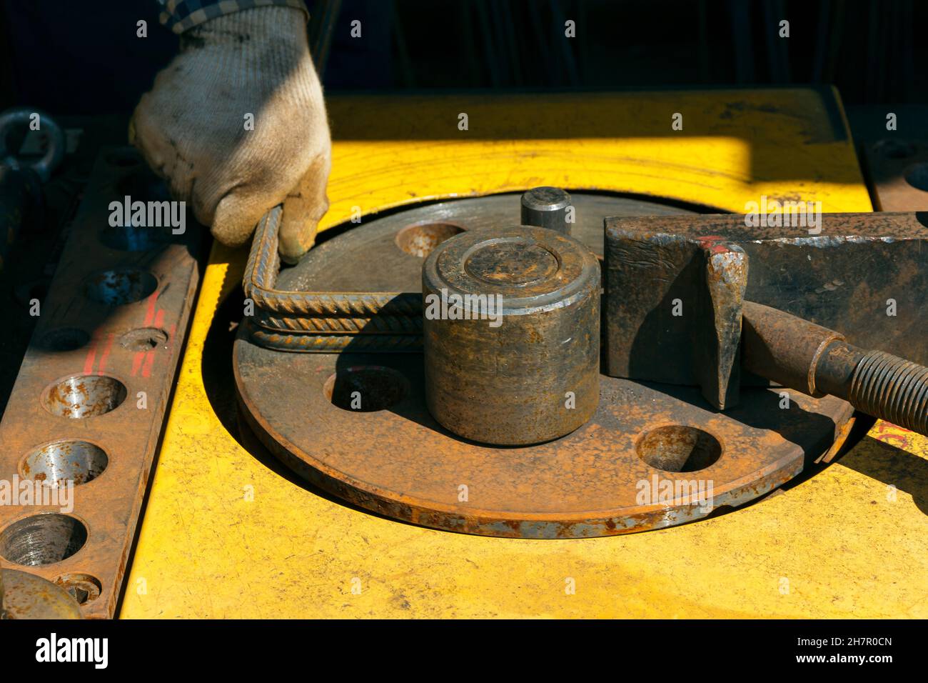 Rebars bending machine in the site. Preparation of parts from rebar