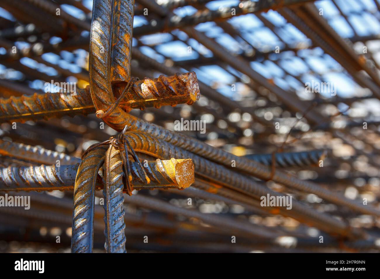 Stacked steel rods for concreting. Preparation of the base for the