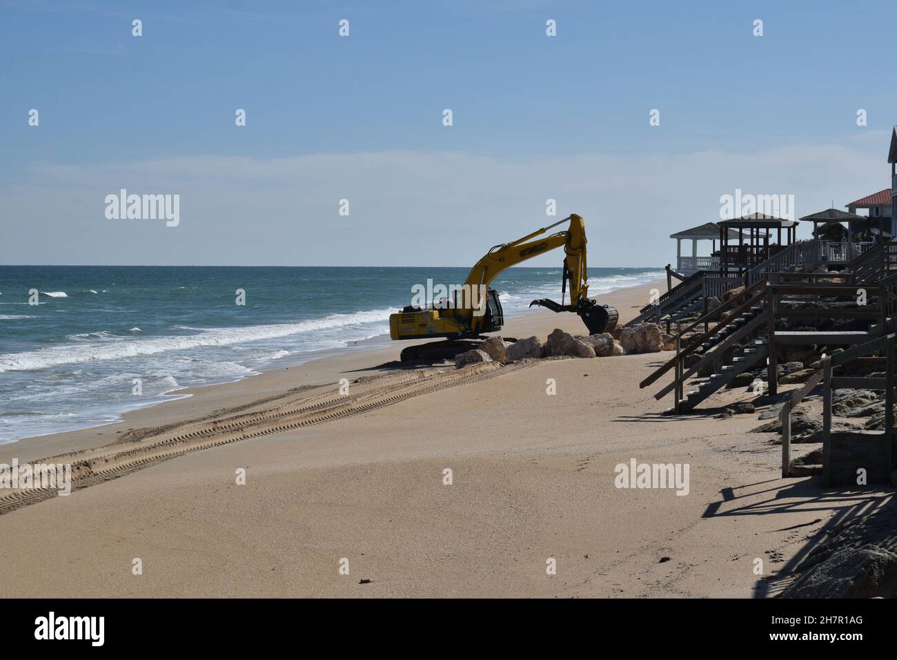 A Digger Works On A Seawall At New Smyrna Beach Florida Stock Photo Alamy