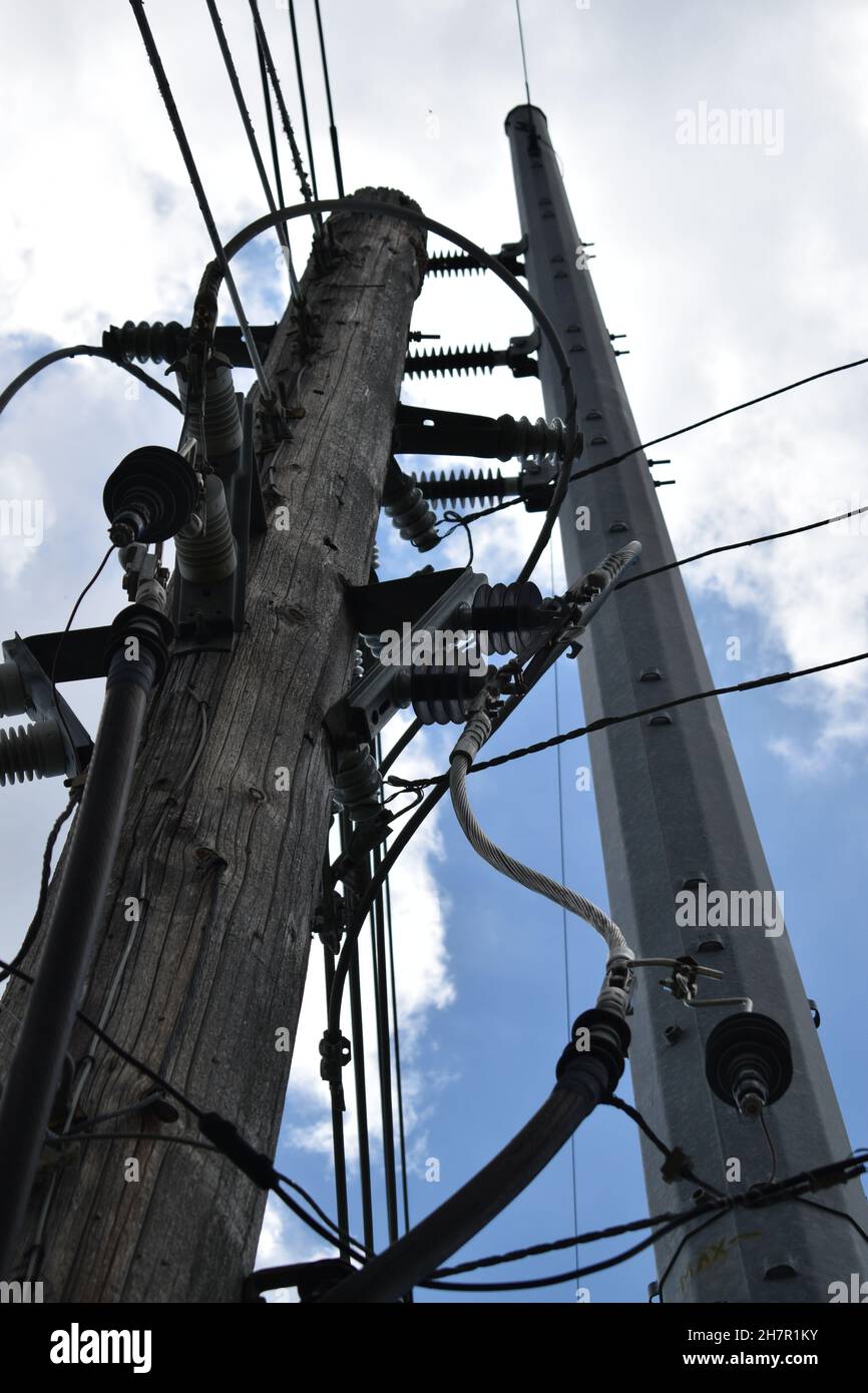 Close-up multiple gadgets on utility poles in rural America. Stock Photo