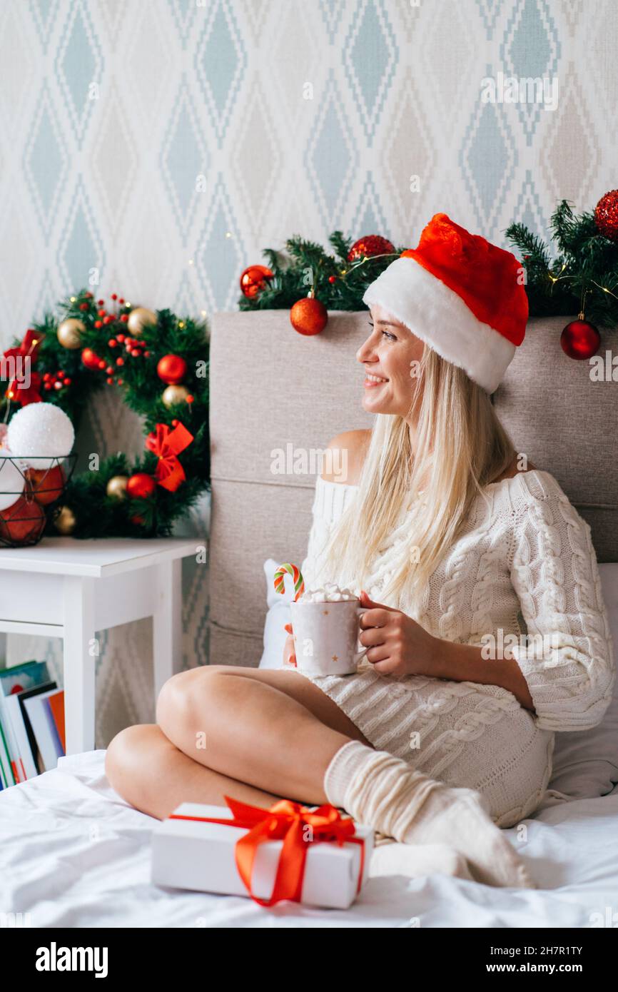 Christmas Dress Santas Favourite Blonde Jumper Blonde Woman Wearing White Knitted  Dress Santa Hat Sit On