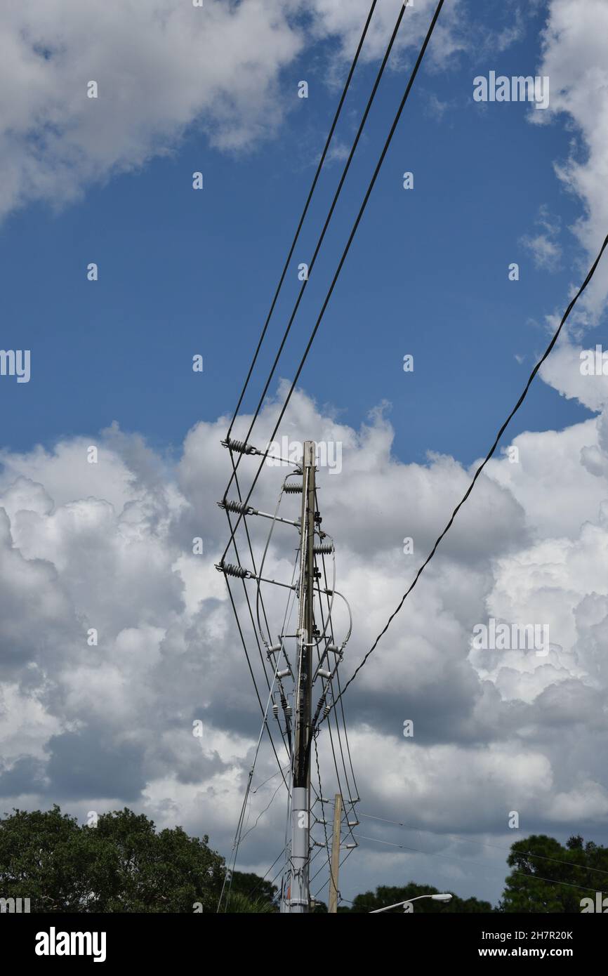 Long insulators hold high voltage lines away from other utility wires. Stock Photo