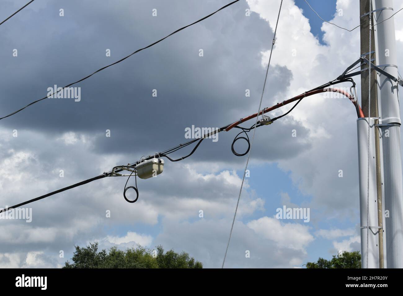 Electrical components attached to utility cable. Stock Photo