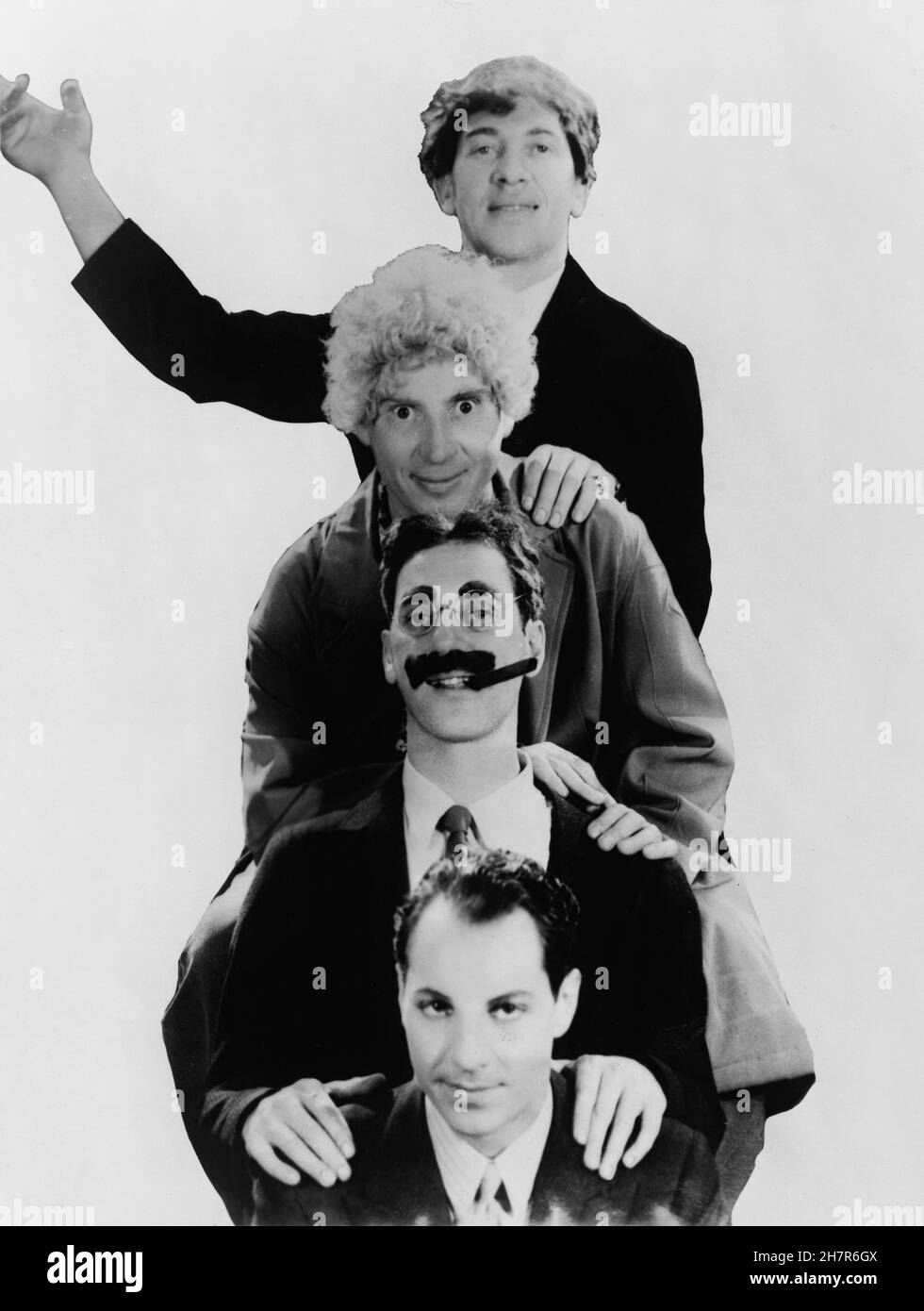 The Marx Brothers, head-and-shoulders portrait, facing front. Top to bottom: Chico, Harpo, Groucho and Zeppo - 1931 Stock Photo