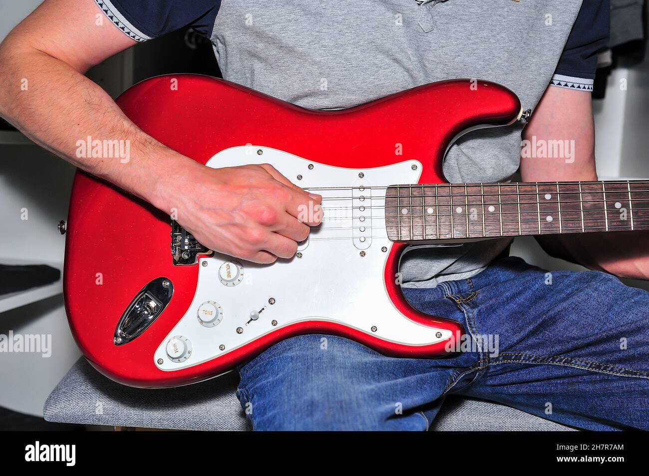 Young boy playing electric guitar. Stock Photo