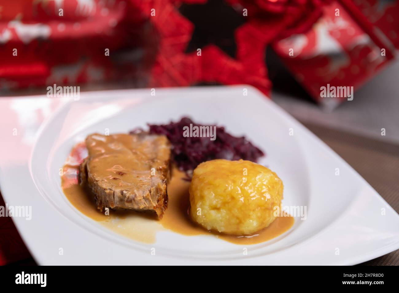 Roast pork with potato dumplings and red cabbage. Home made food