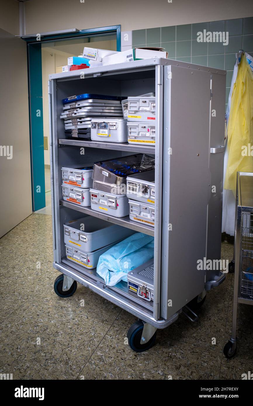 Instrument containers are taken to the sterilization department in a transport cart after the