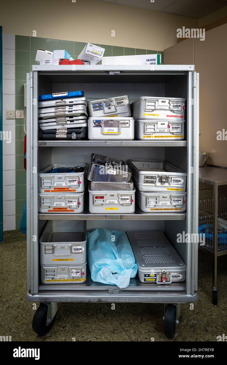 Instrument containers are taken to the sterilization department in a transport cart after the