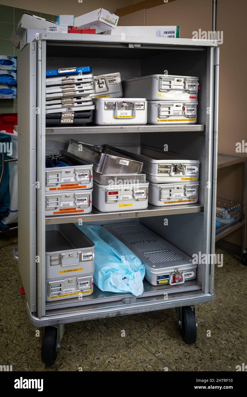 Instrument containers are taken to the sterilization department in a transport cart after the
