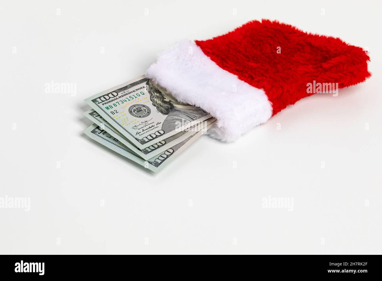 Cash gift of 100 dollar bills in Christmas stocking. Gift tax