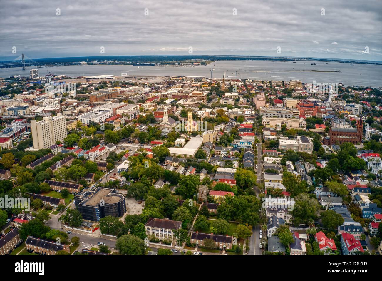 Beautiful aerial view of Charleston with dense buildings under a cloudy